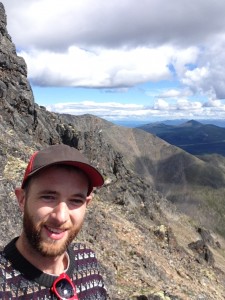 Author taking selfies while scrambling down from the summit of Mount Lorne